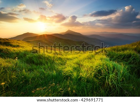 Mountain valley during sunrise. Natural summer landscape
