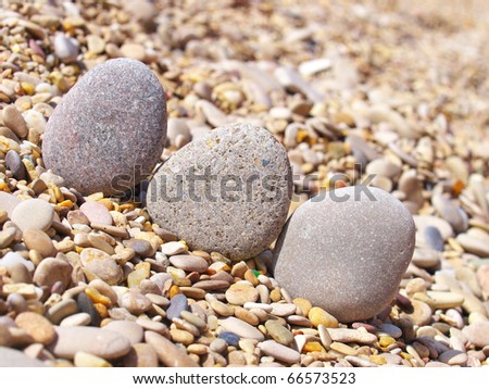 Three stones on seashores. Natural composition