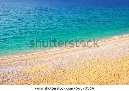 Seashore with bright turquoise by sea. Natural composition