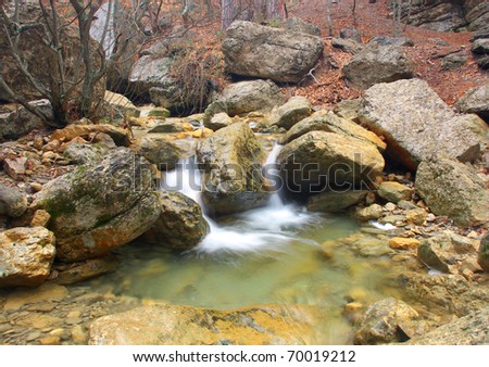 Stone and creek in canyon. Natural composition