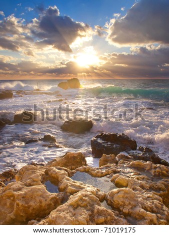Bright sun with ray amongst cloud. Seascape with bright color