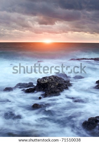 Sea during storm on background dark cloud. Natural composition