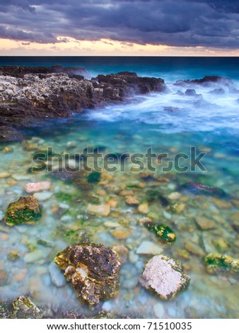Stone in transparent sea water. Natural composition