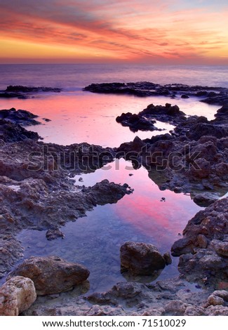 Reflection of the bright sundown in sea water. Natural composition