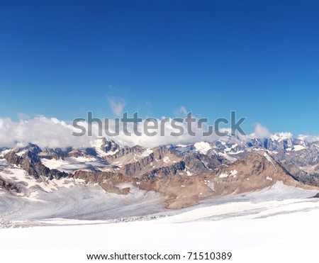 Mountain array on background clean blue sky. Natural composition