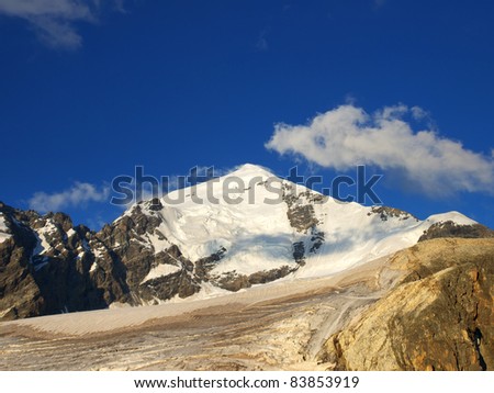 Mountains and snow declivity during sundown. Composition of the nature