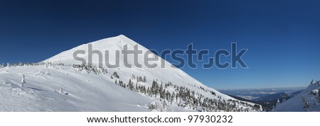 High mountain top and snow plains. Winter composition
