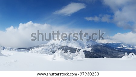 High mountains and snow plains. Winter composition