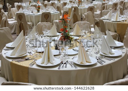 Elegant restaurant tables set for a business event, banquet or wedding