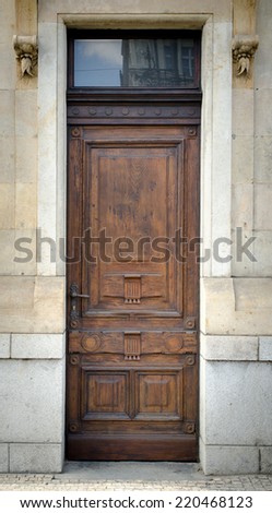Historical Ornate Wooden Door with Glass Pane in a Stone Entry, Prague, The Czech Republic