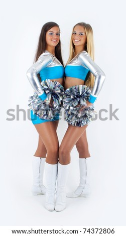 Picture of two young and attractive cheerleaders.