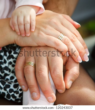 family\'s hands together