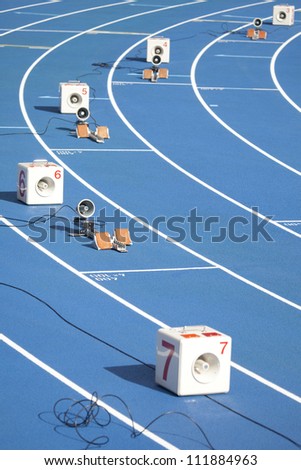 Start block of sprinters and loudspeaker