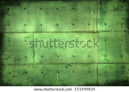 Aged copper background with screws