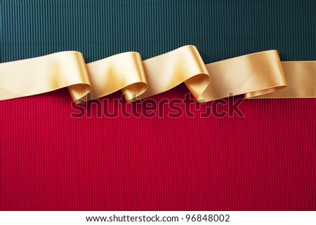 Gold ribbon banner on corrugated cardboard