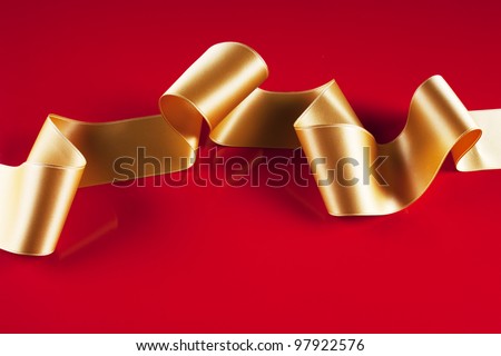 Gold ribbon banner on red background