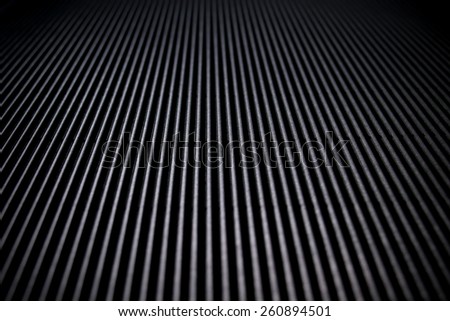 abstract black background or design pattern of vertical lines on faint vintage pattern of vintage grunge background