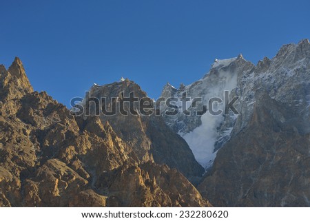 snow Avalanche on the top of mountain. Karakorum mountains in Pakistan.