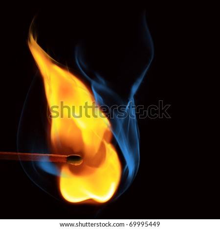 Burning match with blue and  yellow smoke over black background.