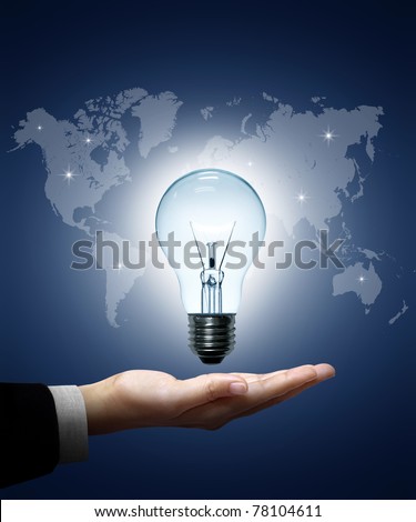 Light bulb in hand businessman on world map blue background