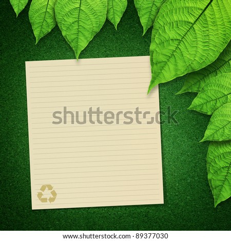 paper recycle and green leaves