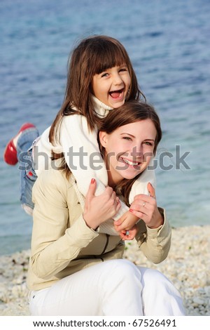 Family at sea, mother and daughter