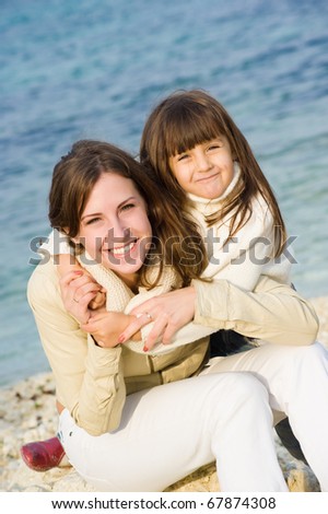 Family at sea, mother and daughter