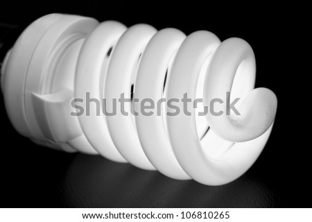 close-up of a energy saver lightbulb on black background