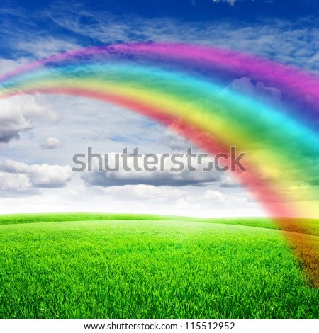 Green field under blue sky with sun and rainbow. Beauty nature background