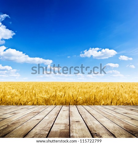 Wood Floor Over Yellow Wheat Field Under Nice Sunset Cloud Sky Background