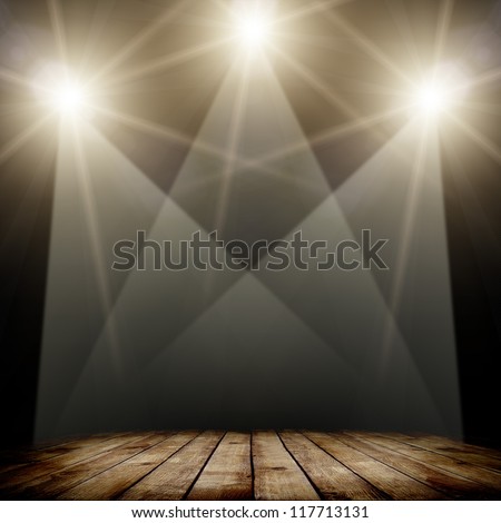 concert spot lighting over dark background and wood floor