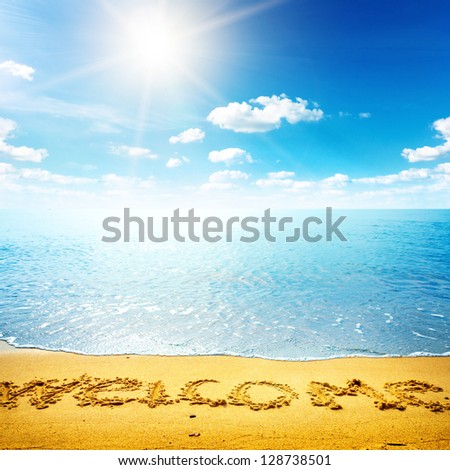 Beauty seascape. Word welcome on the sand beach. Nature background