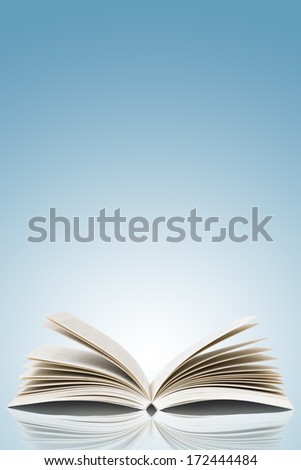 Open Book Isolated On Blue Background