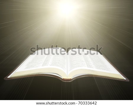 open Holy Bible with rays of light