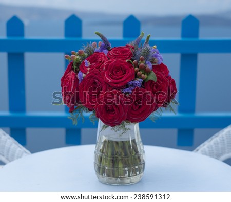 A bouquet of red roses from a Greek wedding.