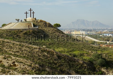 three large crosses on a hill over looking the town of Rojales, Spain