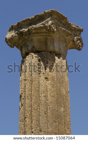 A single column top from an ancient temple at Olympia, Greece