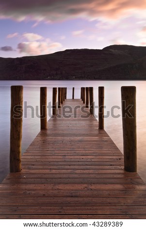 Wooden landing stage at Derwent water on a calm morning
