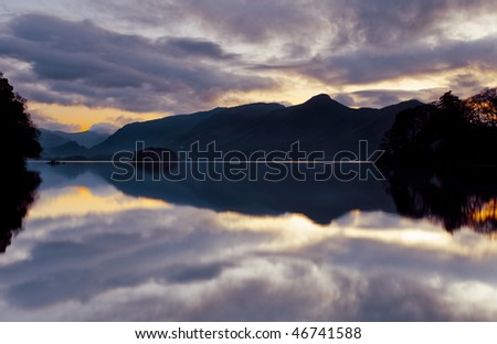 Calm waters at sunset at Derwent water in Cubmbria