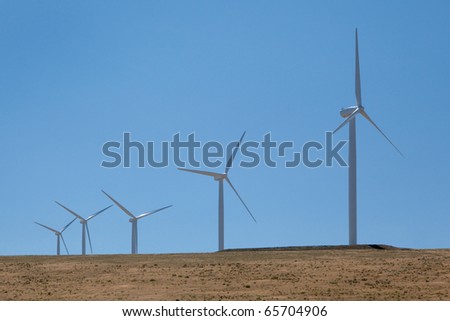 Green power is being produced from massive wind generators.