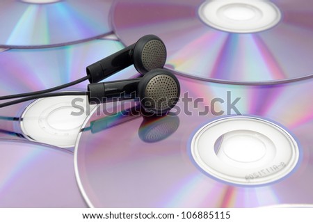 CD and ear plugs (to express the concept of listening to music)