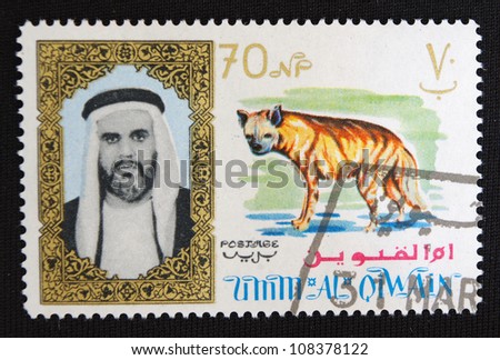 UNITED ARAB EMIRATES - CIRCA 1973: A stamp printed in United Arab Emirates shows Dog, circa 1973