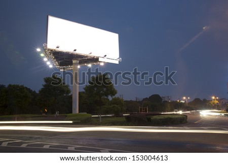 Billboard at night light trails