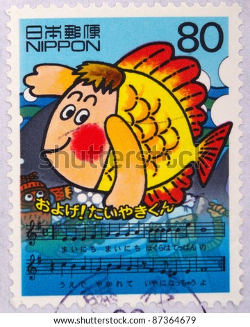 JAPAN - CIRCA 2000: A stamp printed in Japan shows Fish and Music, circa 2000
