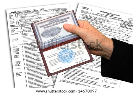 IRS agent presenting his credentials before initiating a federal income tax examination.