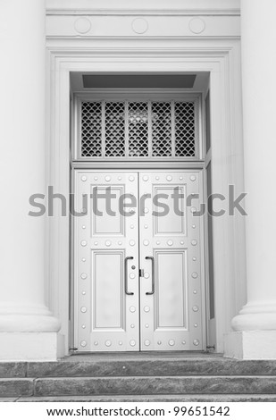 Large polished steel security doors at the entrance of the Supreme Court in Tallahassee, Florida.