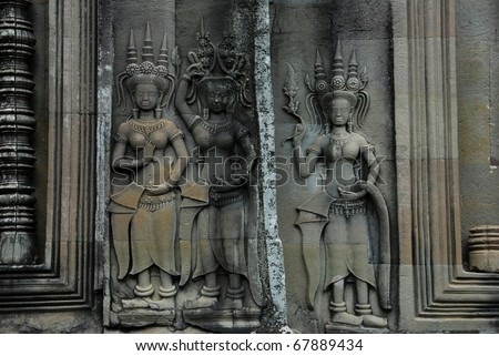 Ancient stone relief carvings of khmer venus (Apsara) on the wall in Angkor Wat, Cambodia