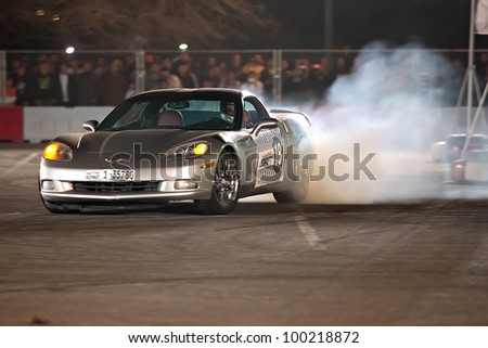 MISHREF, KUWAIT - FEBRUARY 10: An unidentified driver in a Corvette participates in the Red Bull Kuwait Car Park Drift competition on February 10, 2012 at the Kuwait International Fair (KIF) in Mishref, Kuwait.
