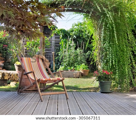 lounge chair on wooden terrace garden