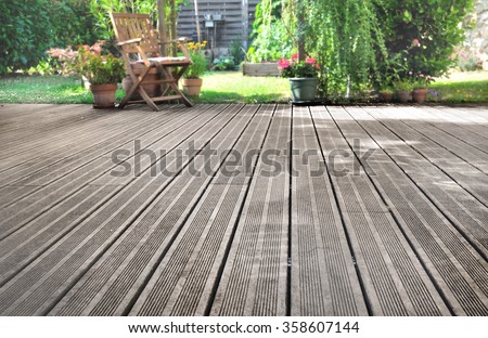 slats of a wooden terrace overlooking garden